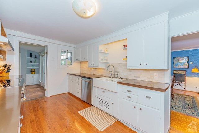 kitchen featuring white cabinets, stainless steel dishwasher, tasteful backsplash, and light hardwood / wood-style flooring