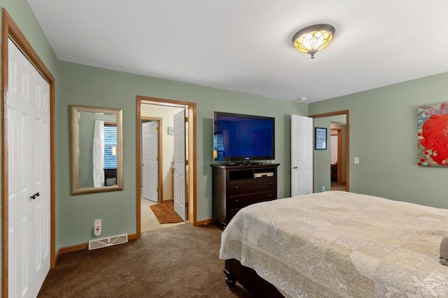 carpeted bedroom with a closet