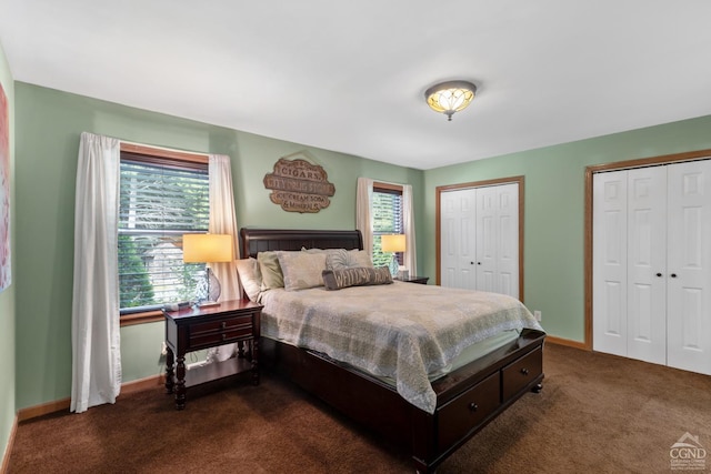 carpeted bedroom featuring multiple closets