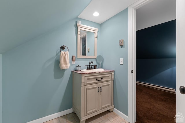 bathroom featuring vanity and vaulted ceiling