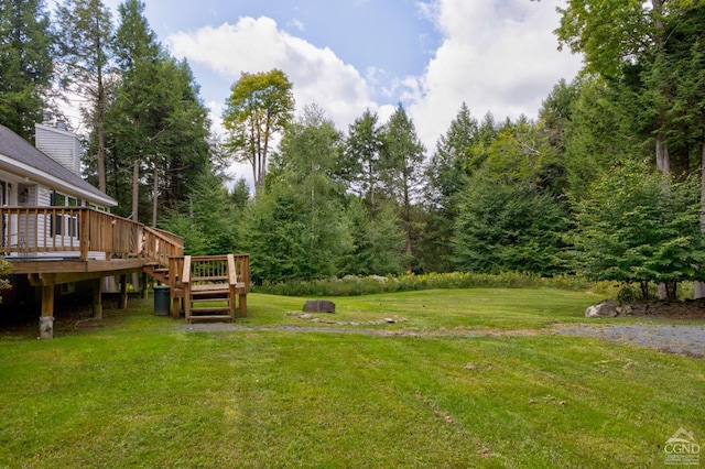 view of yard with a wooden deck