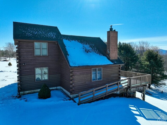 exterior space featuring a wooden deck