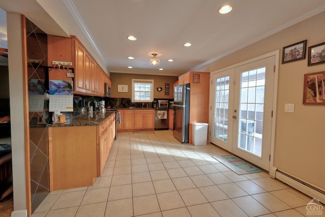 kitchen featuring french doors, stainless steel appliances, crown molding, and a baseboard heating unit