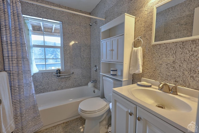 full bathroom with vanity, shower / bath combination with curtain, and toilet