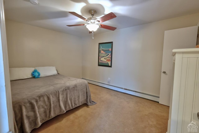 carpeted bedroom with ceiling fan and baseboard heating