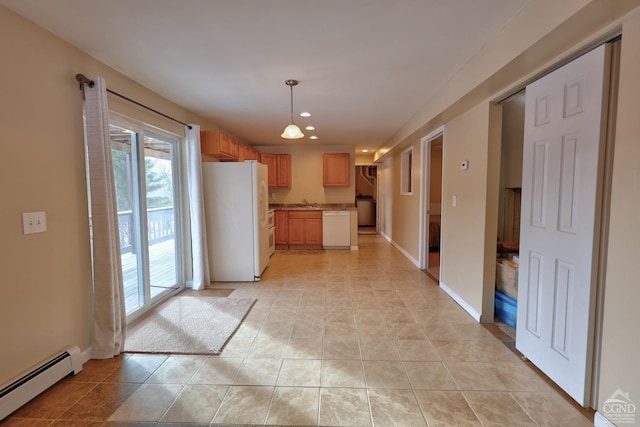 kitchen with white appliances, baseboard heating, light tile patterned floors, washer / clothes dryer, and hanging light fixtures