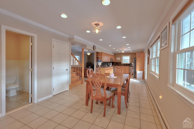 dining space with light tile patterned floors, ceiling fan, and crown molding