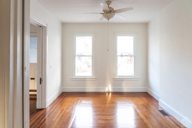 spare room with ceiling fan and wood-type flooring