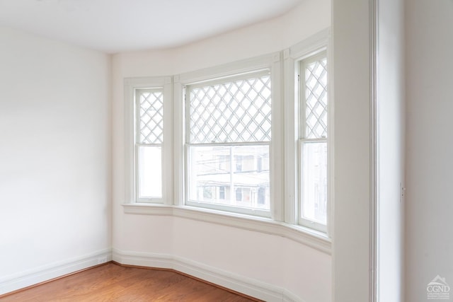 unfurnished room featuring hardwood / wood-style floors