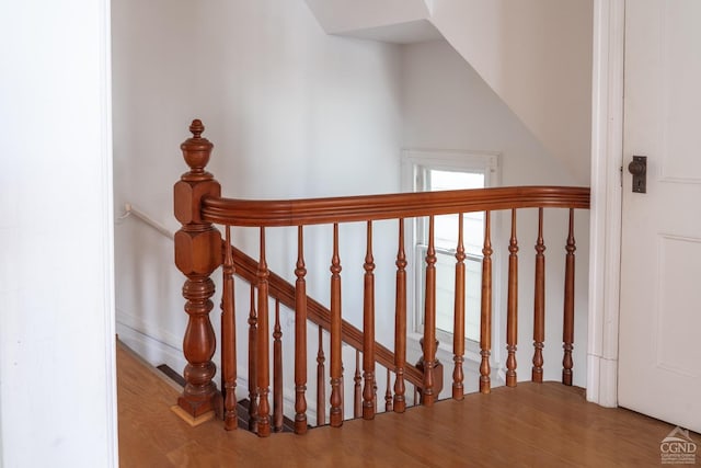 stairway featuring hardwood / wood-style floors