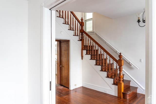 staircase featuring hardwood / wood-style floors