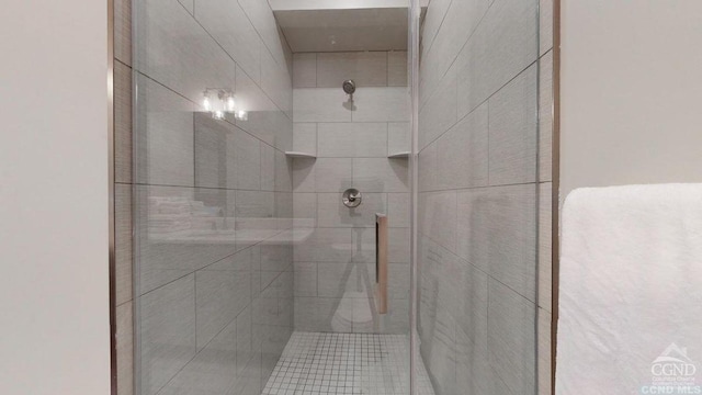 bathroom with a tile shower