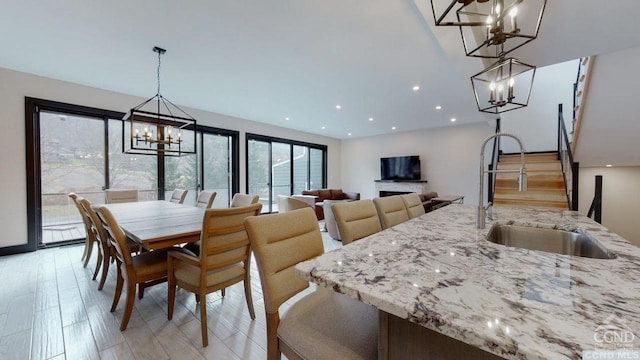 dining area featuring light hardwood / wood-style floors and sink