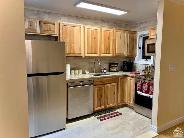 kitchen featuring decorative backsplash, appliances with stainless steel finishes, light stone countertops, ornamental molding, and sink