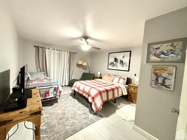 bedroom featuring ceiling fan and wood-type flooring