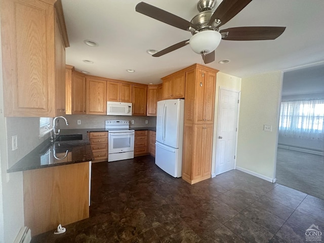 kitchen with white appliances, baseboards, baseboard heating, and a sink