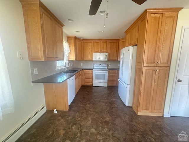 kitchen featuring white appliances, a ceiling fan, a baseboard radiator, a sink, and dark countertops