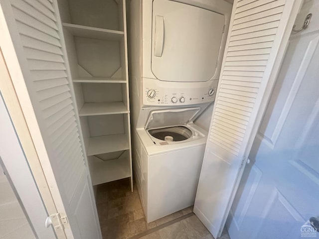 laundry room featuring laundry area and stacked washing maching and dryer