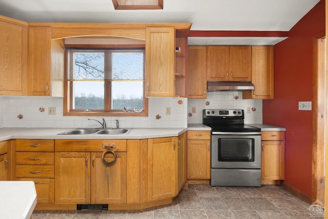 kitchen featuring light tile patterned floors, sink, tasteful backsplash, and electric stove