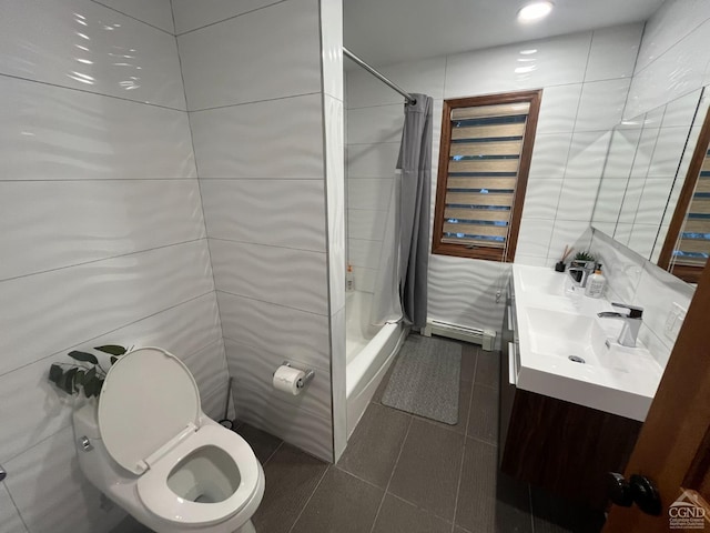 bathroom with a shower with curtain, vanity, tile patterned floors, and tile walls