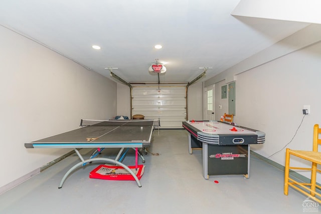 playroom with electric panel and concrete flooring