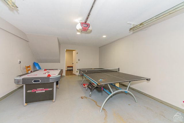 recreation room featuring concrete flooring