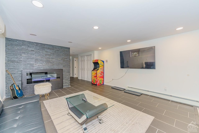 unfurnished living room with dark tile patterned floors, a fireplace, and a baseboard radiator