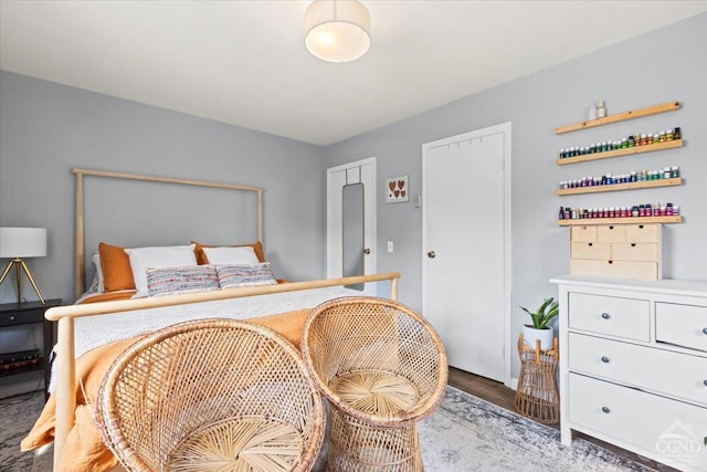 bedroom with dark wood-type flooring