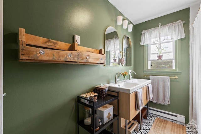 bathroom with vanity and a baseboard radiator