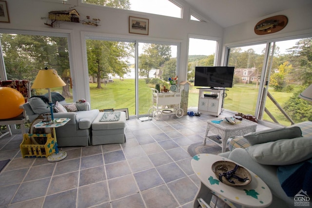 sunroom / solarium featuring vaulted ceiling