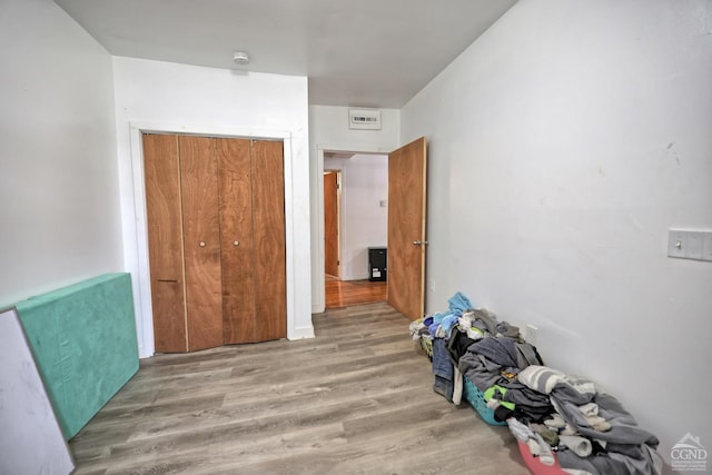 interior space featuring a closet and hardwood / wood-style floors