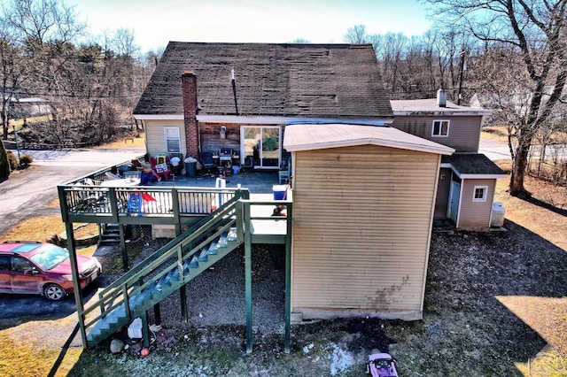 rear view of house featuring a deck