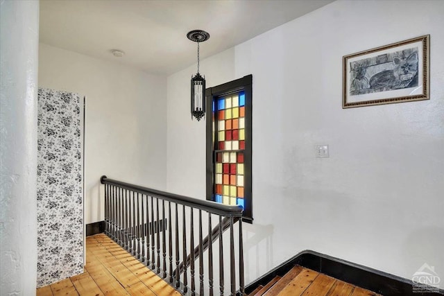 stairway featuring hardwood / wood-style floors