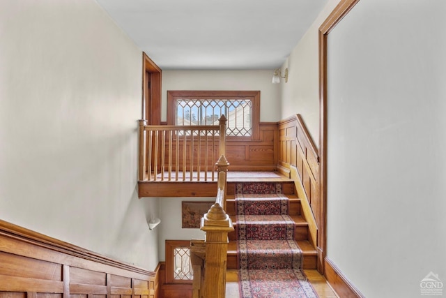 stairway featuring hardwood / wood-style floors