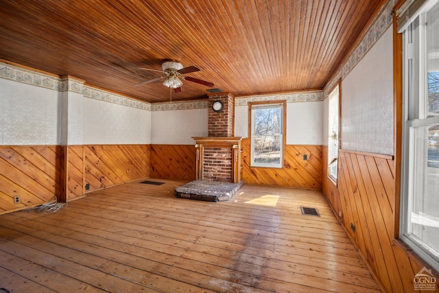 wooden terrace featuring ceiling fan and visible vents