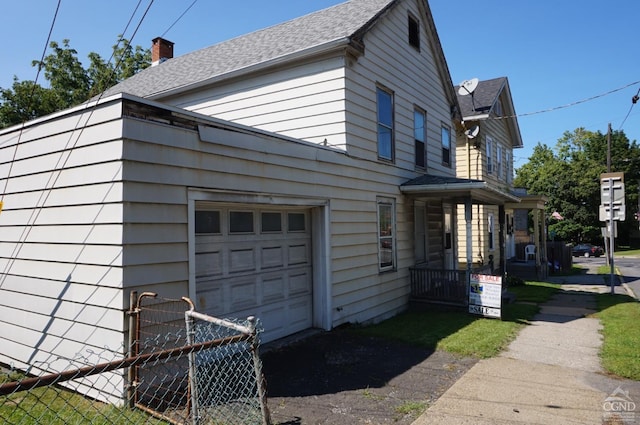 view of home's exterior with a garage