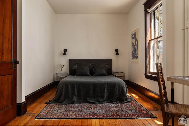 496 Clinton St, Hudson, NY 12534 - bedroom with wood-type flooring and baseboards
