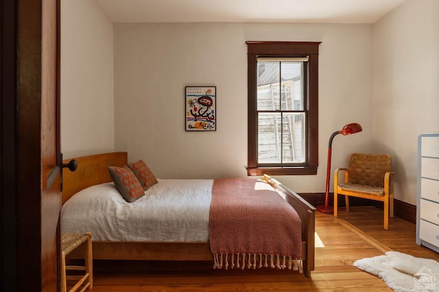496 Clinton St, Hudson, NY 12534 - bedroom featuring baseboards and wood finished floors