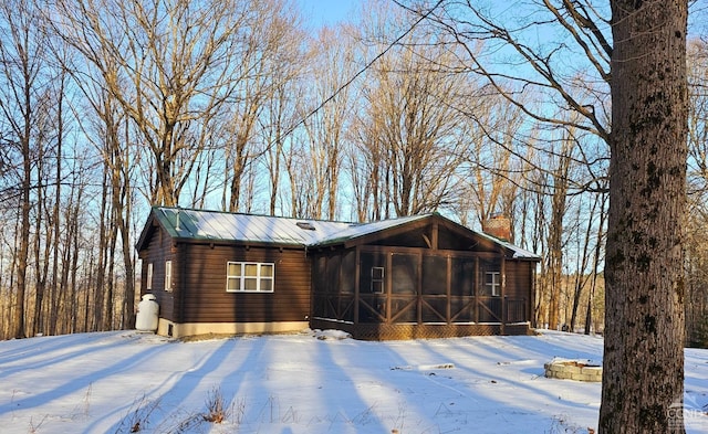 view of front facade with a sunroom