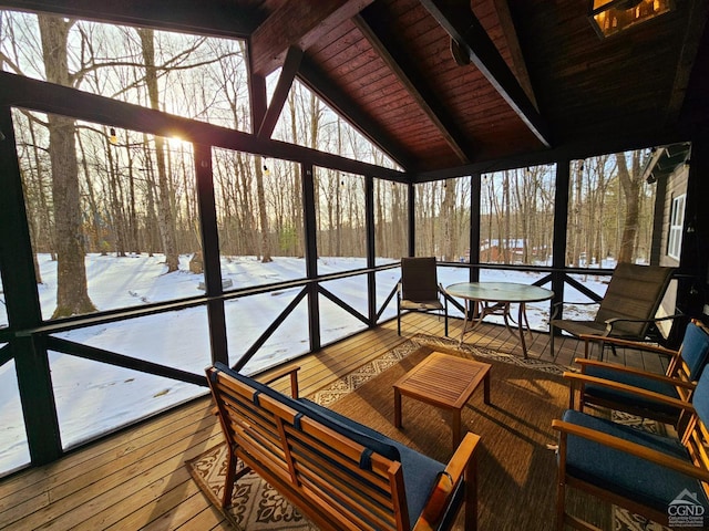 sunroom featuring vaulted ceiling with beams and wood ceiling