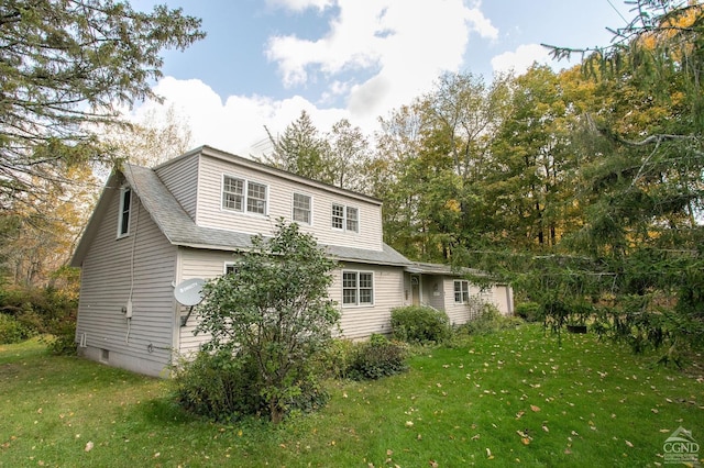 back of house featuring a yard