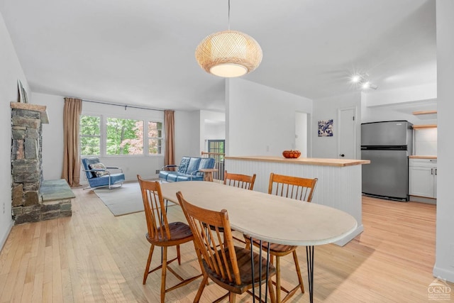 dining room with light hardwood / wood-style flooring