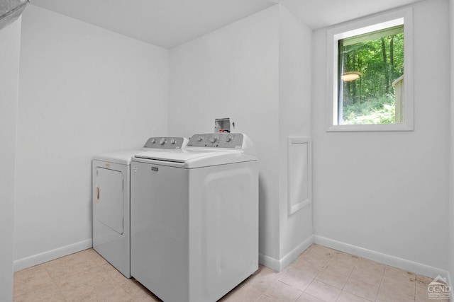 washroom featuring washer and clothes dryer