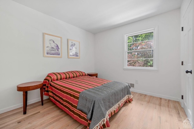 bedroom featuring light wood-type flooring