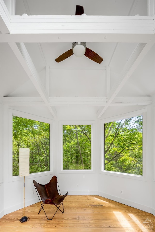 sitting room with baseboards, a ceiling fan, and wood finished floors