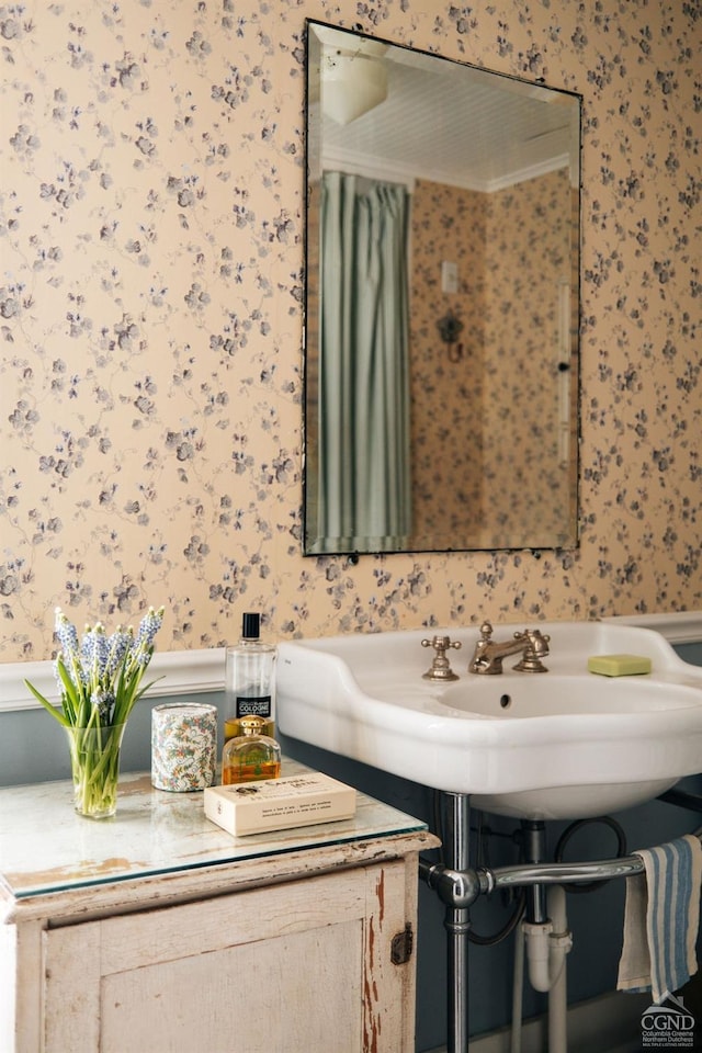 bathroom featuring wallpapered walls