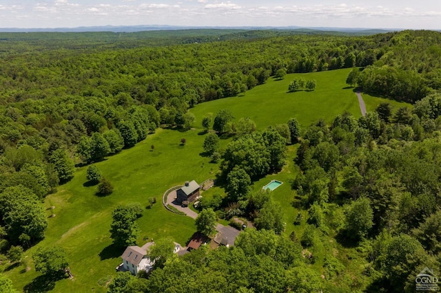 drone / aerial view featuring a forest view