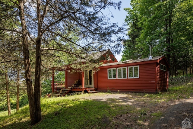 back of property featuring driveway