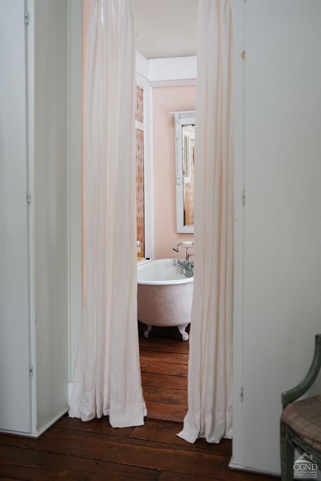 interior space with a sink and hardwood / wood-style flooring