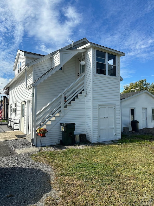 view of home's exterior featuring a lawn